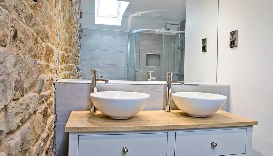 The en-suite bathroom at Mixon View, with exposed stone