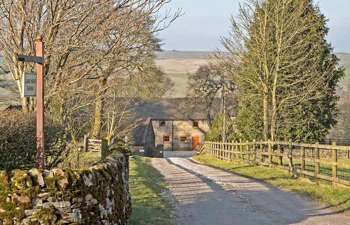 The approach to Lane Head Farm, with the Lane Head Barns sign and Morridge View beyond